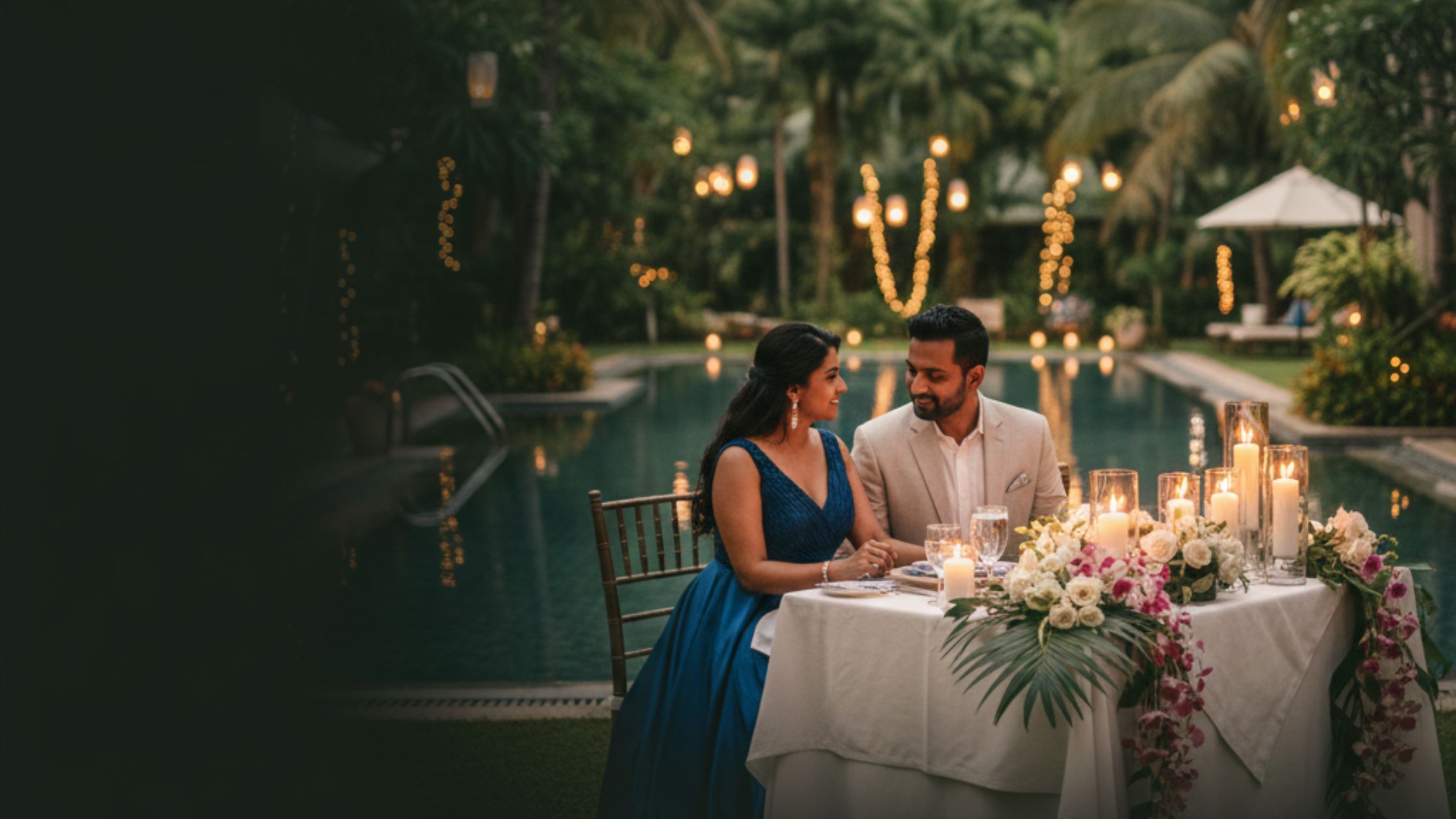 Couple celebrating anniversary at luxury anniversary celebration resorts Bangalore surrounded by nature and romantic decor